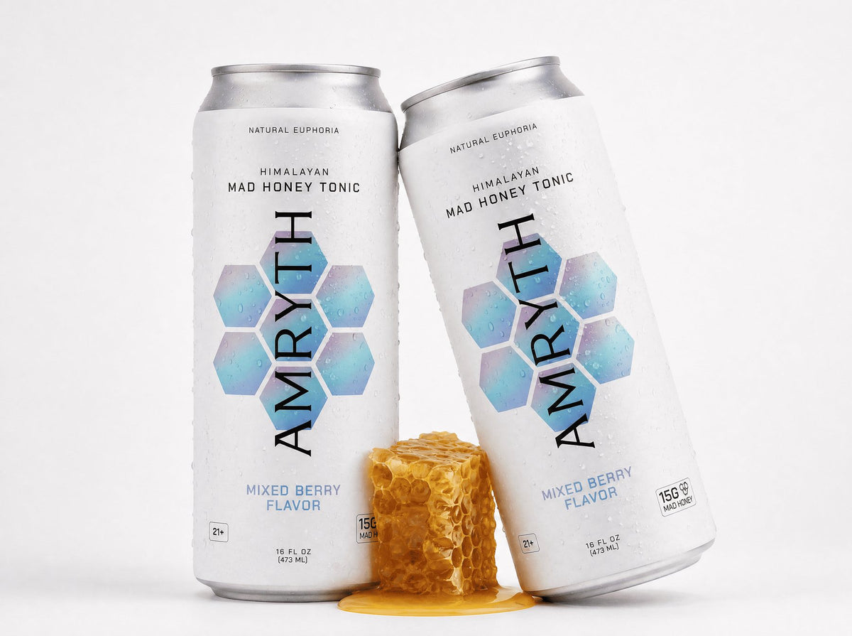 Two Amryth cans with a piece of honeycomb